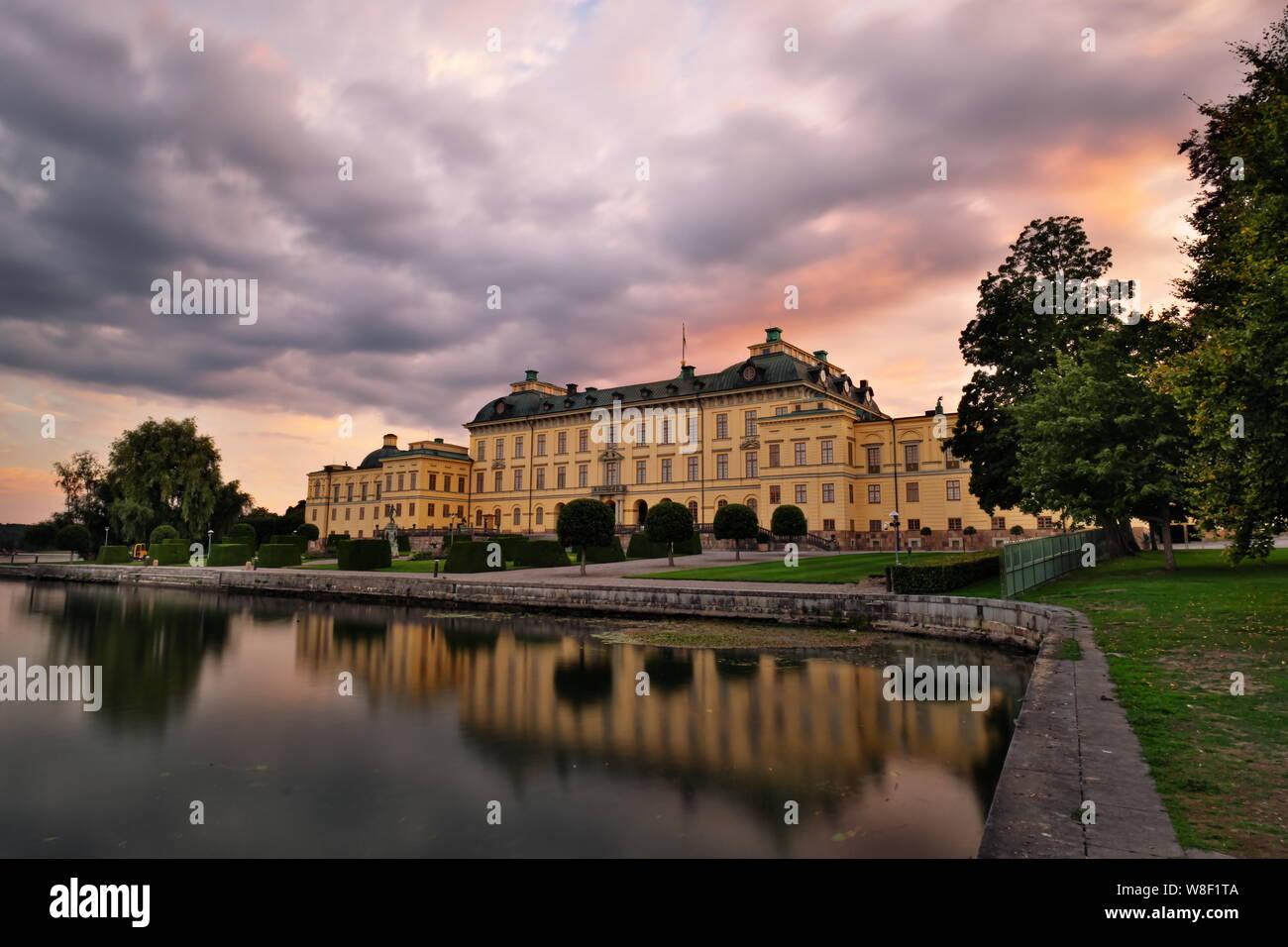 Drottningholm Palace during sunset with reflection in Lake Mälar, Sweden Stock Photo