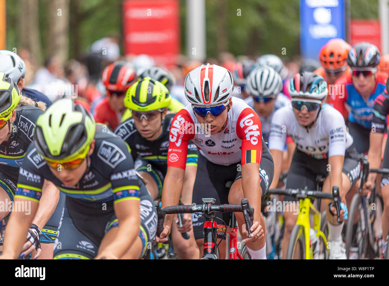 Peloton of female cyclists racing in the Prudential RideLondon Classique cycle race. Female cyclist rider. Annelies Dom of Lotto Soudal Ladies Stock Photo