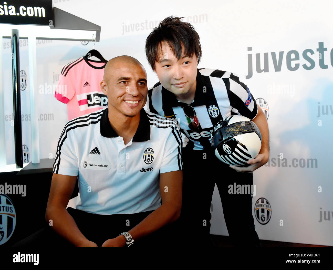 Former Juventus soccer star David Trezeguet, left, poses with a football  fan at an official launch event for Juventus' Asian online store  juvestoreasi Stock Photo - Alamy