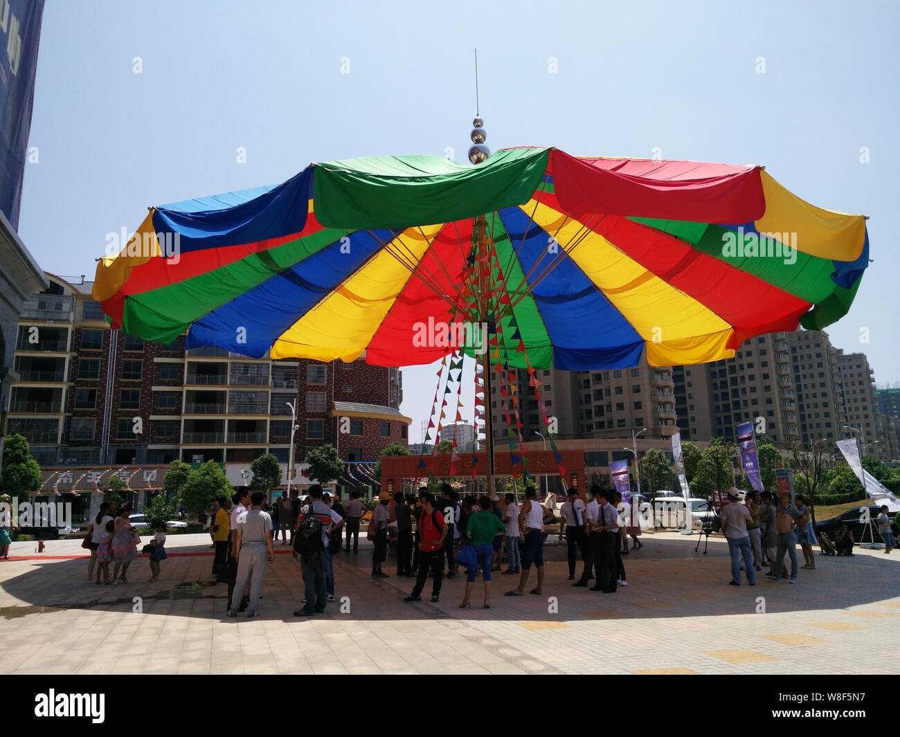 People stand under the world's biggest umbrella after it was certified