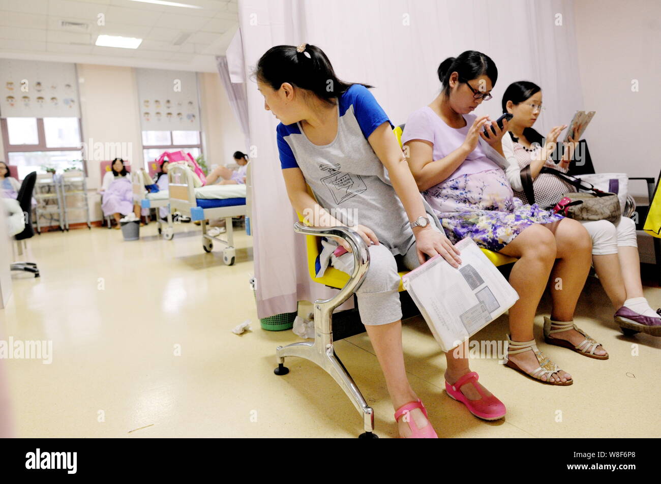 --FILE--Young pregnant women wait for physical examinations at the Nanjing Maternity and Child Health Care Hospital in Nanjing city, east China's Jian Stock Photo