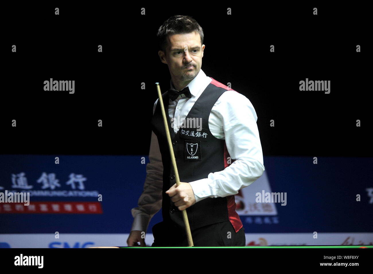 Michael Holt of England considers a shot against Stephen Maguire of England during their first round match of the 2015 World Snooker Shanghai Masters Stock Photo