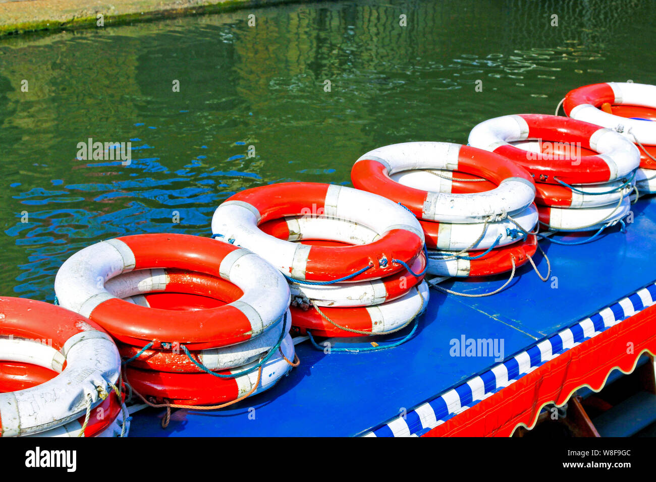 Bunch of life rings on boat in the river Stock Photo Alamy