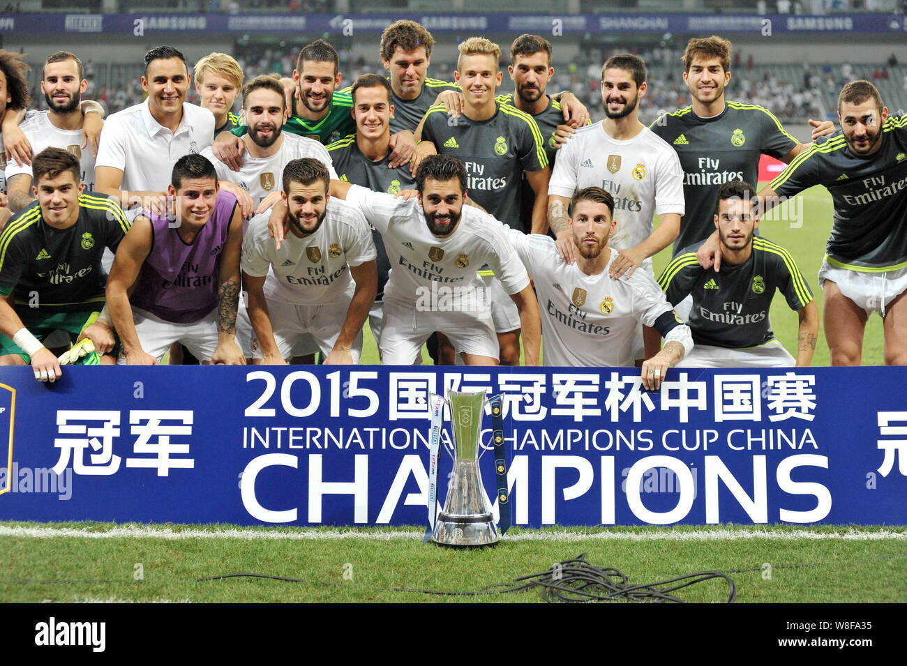 Troubled projektor egyptisk Players of Real Madrid pose for photos with the winner's trophy after  defeating AC Milan during the Shanghai match of the International Champions  Cup Stock Photo - Alamy