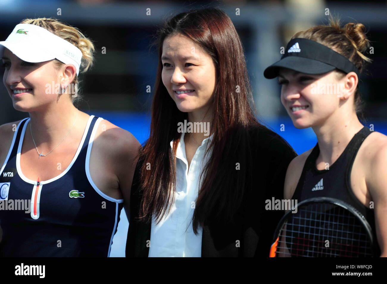 --FILE--(From left) Timea Bacsinszky of Switzerland, retired Chinese tennis star Li Na and Simona Halep of Romania pose before the women's singles fin Stock Photo