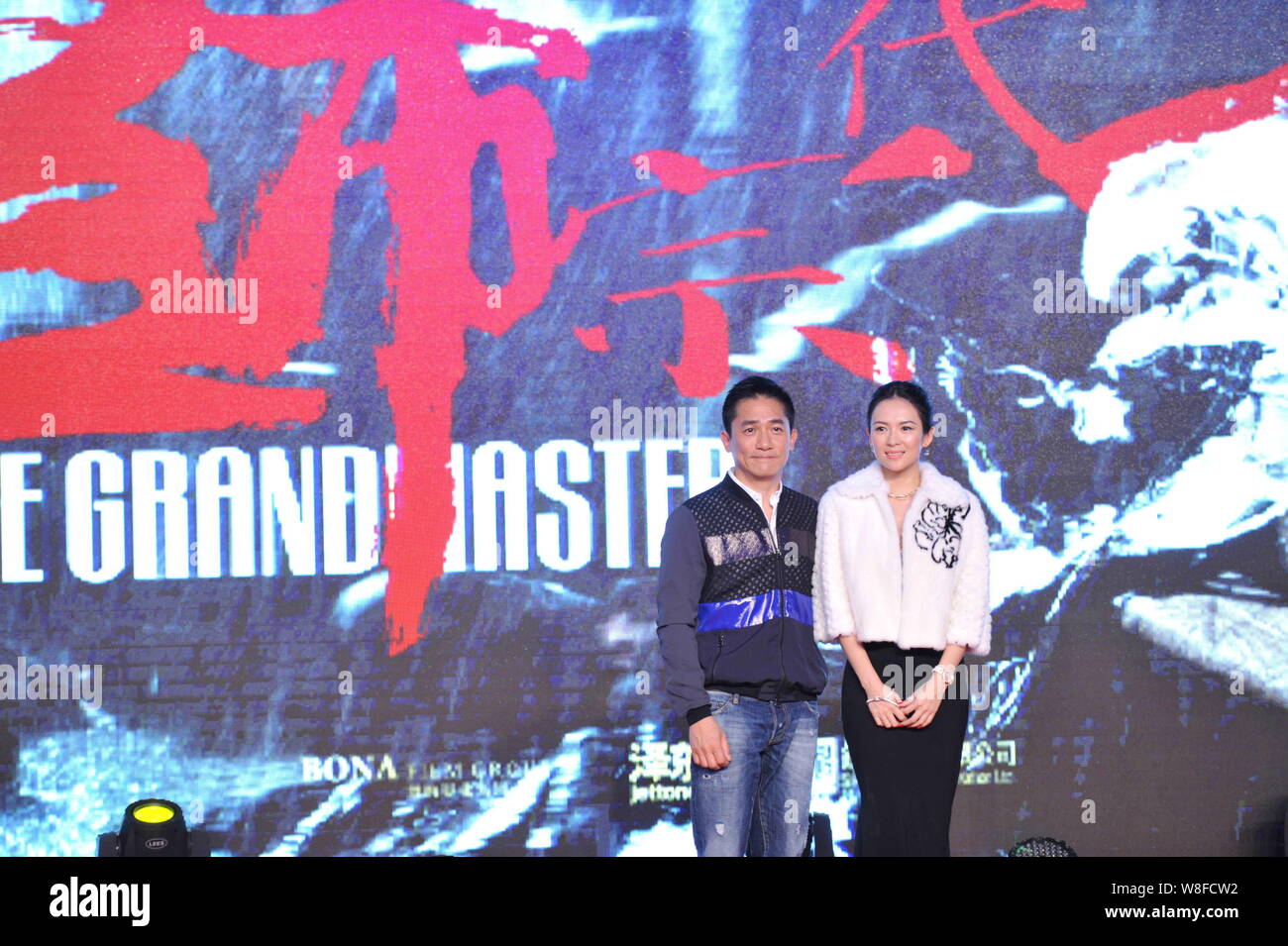 Chinese actress Zhang Ziyi, right, and Hong Kong actor Tony Leung pose at the press conference for the premiere of their movie "The Grandmaster 3D" in Stock Photo