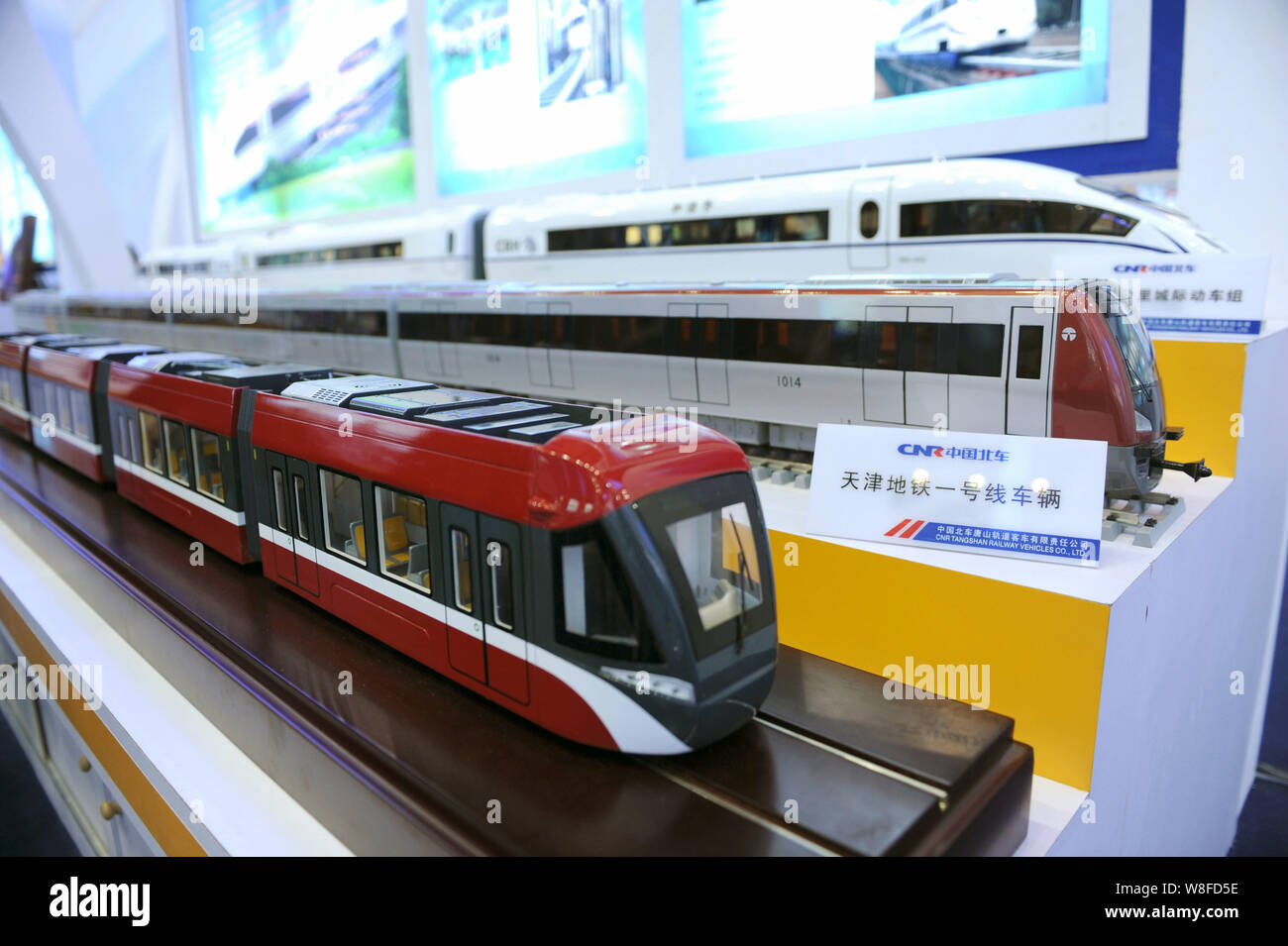 --FILE--Models of trains are displayed at the stand of CNR (China Northern Locomotive and Rolling Stock Industry (Group) Corporation) during an exhibi Stock Photo