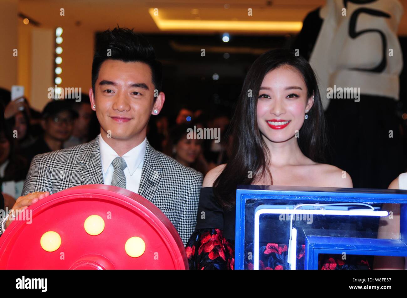 Chinese actress Ni Ni, right, and actor Zheng Kai pose during a