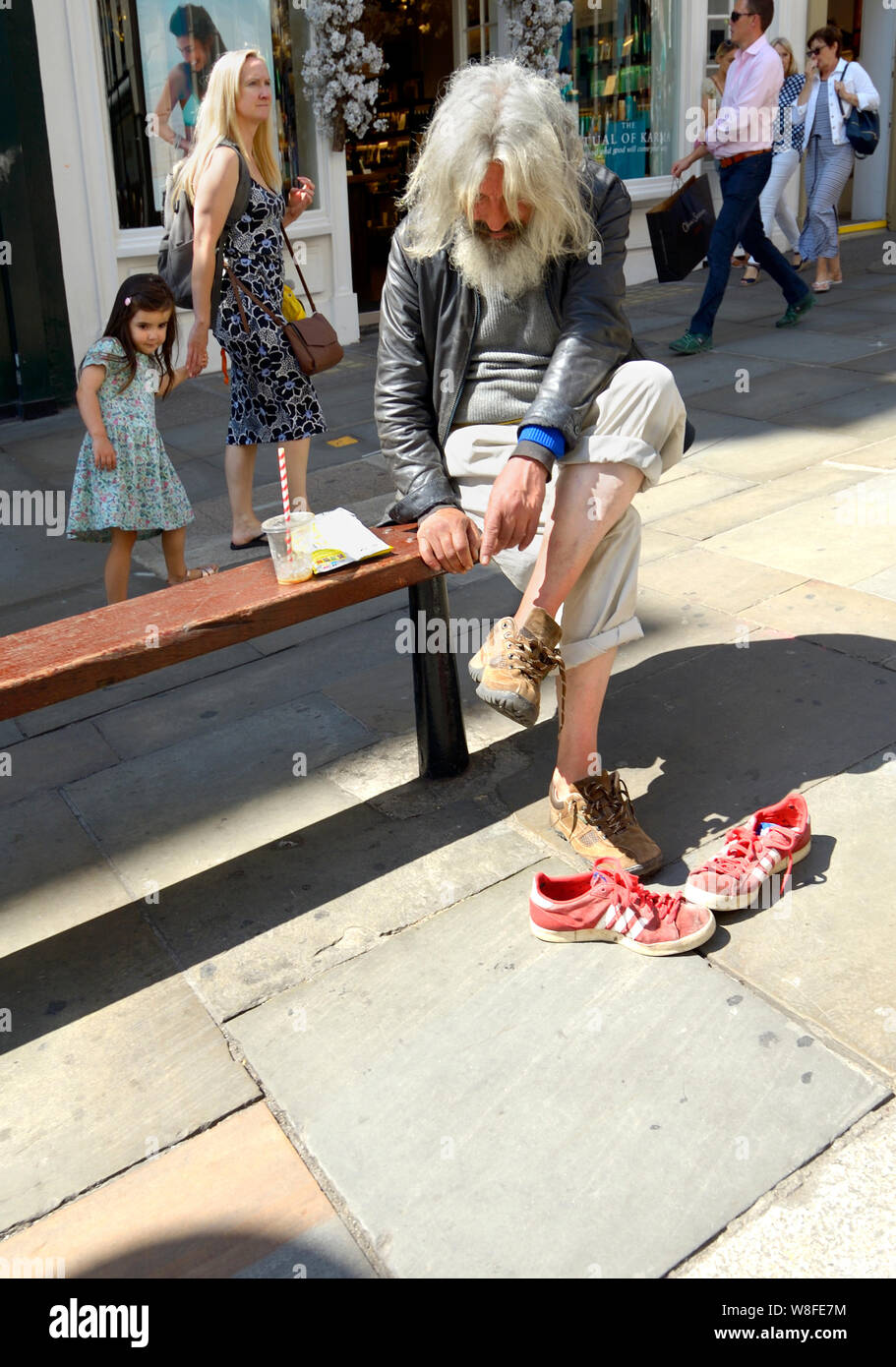 Old man watching young girl hi-res stock photography and images - Alamy