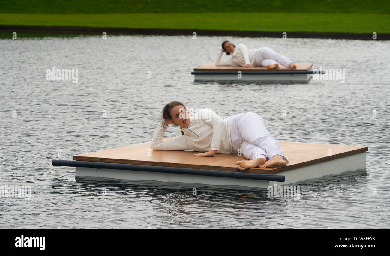 Edinburgh, Scotland, UK. 9 August 2019. Trisha Brown: In Plain Site reconceives some of the US choreographer’s most striking short dance pieces in dynamic relationships with the enchanting landscape of Jupiter Artland — on floating rafts in Charles Jencks’ lakes, in its rich woodlands and sculpted landforms.Credit; Iain Masterton/Alamy Live News Stock Photo