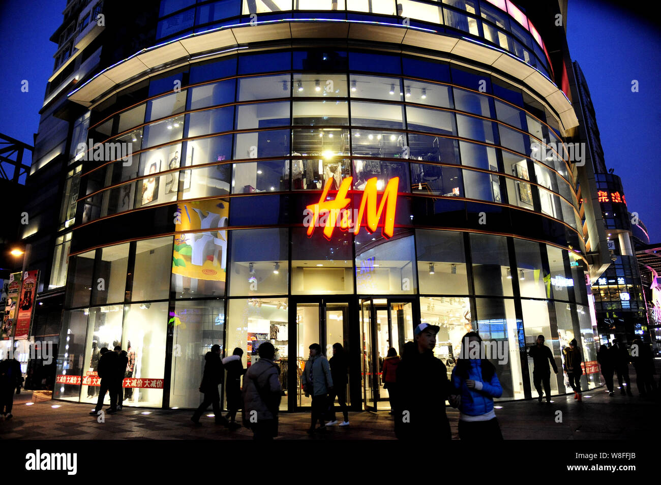 FILE--View of a store of H&M in Shenyang city, northeast China's Liaoning  province, 27 December 2014. Fast-fashion is all the rage among retailers  Stock Photo - Alamy