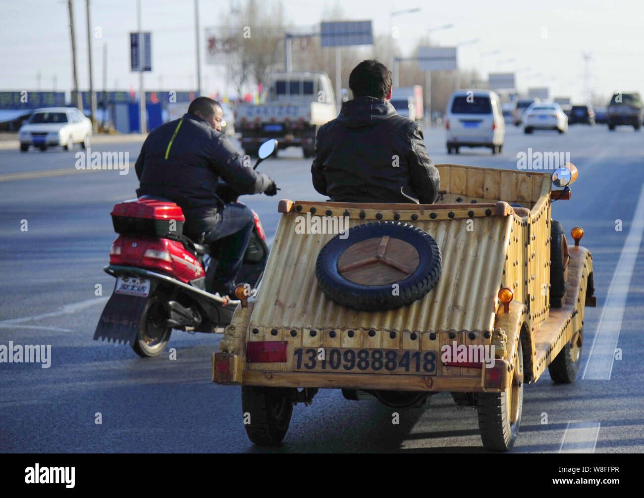Chinese carpenter Liu Fulong testdrives his third homemade wooden