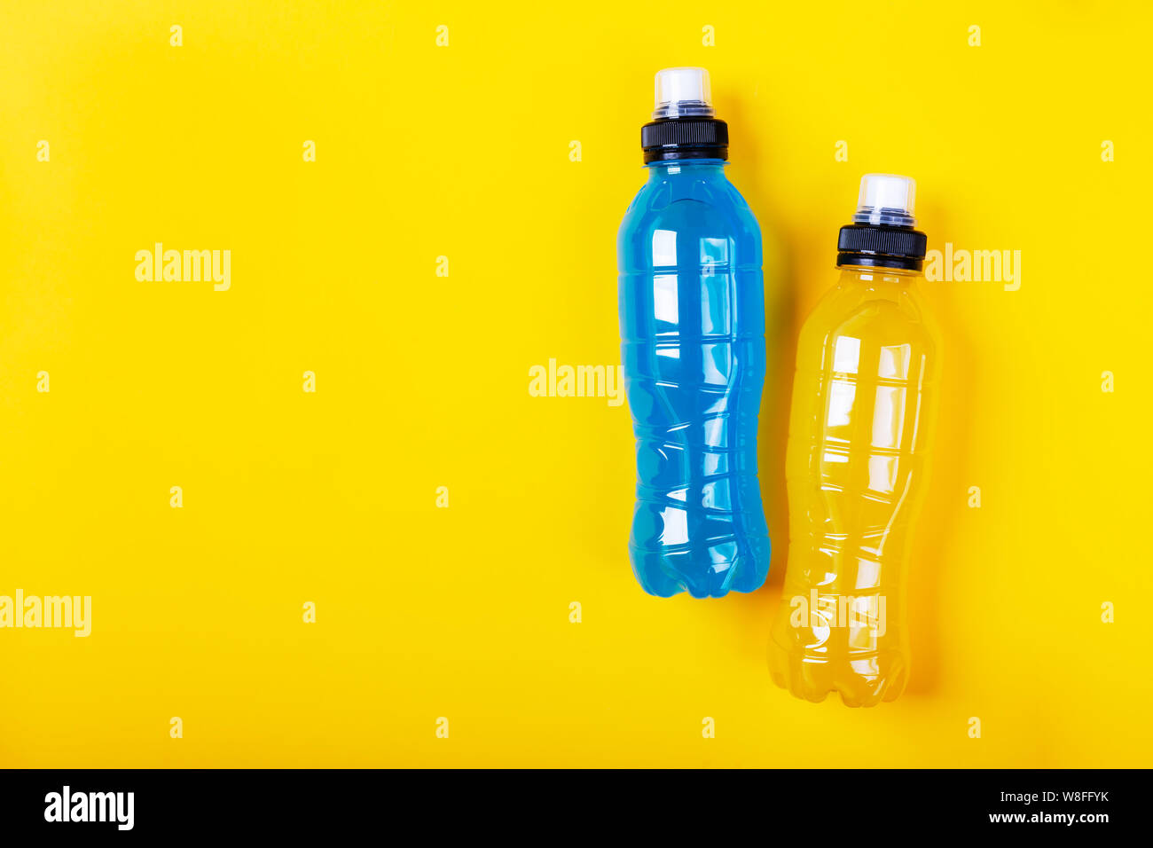 Isotonic Energy Drink Bottle With Blue And Yellow Transparent Liquid Sport Beverage On A Colorful Background It Usually Contains Salt And Sugar And Stock Photo Alamy
