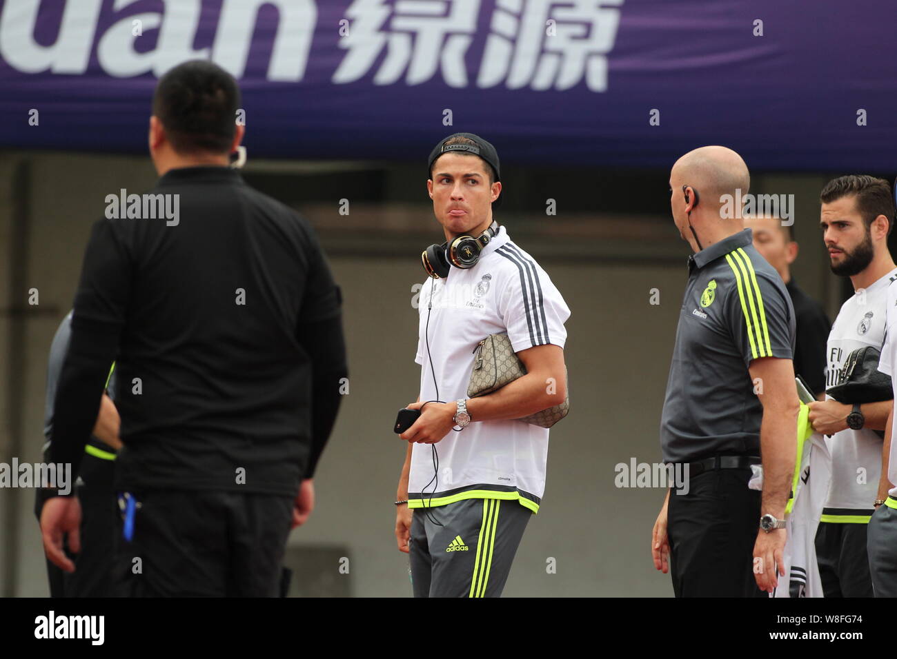 Cristiano Ronaldo of Real Madrid, center, arrives for a training session in Guangzhou city, south China's Guangdong province, 26 July 2015. Stock Photo