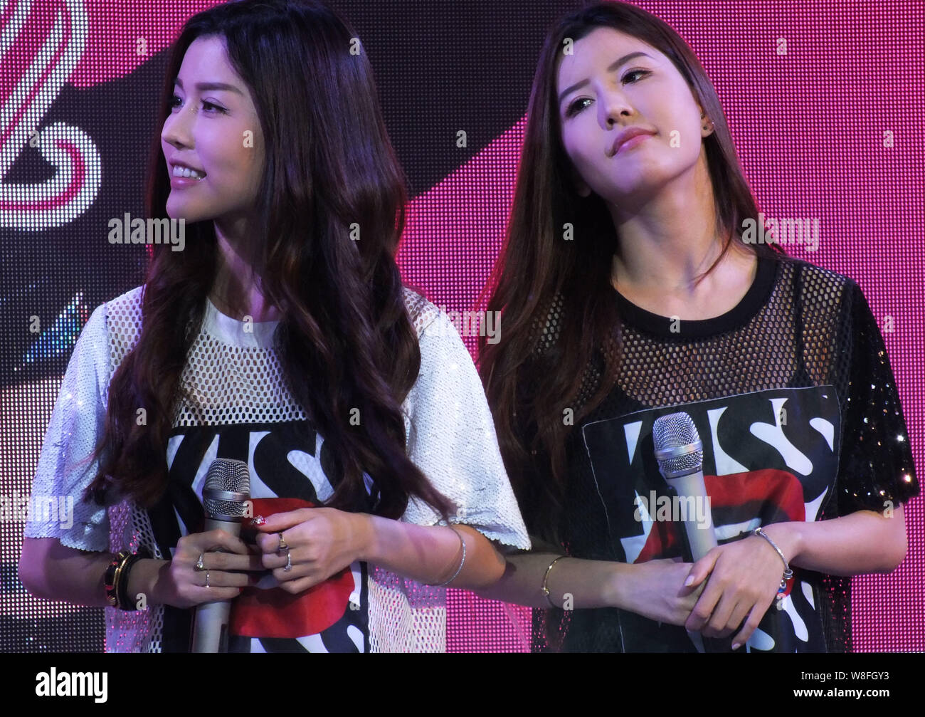The Twin Sisters Miko And Yumi Of Singaporean Pop Duo By2 Attend A Promotional And Media Event For Their Seventh Music Album Cat And Mouse In Yichan Stock Photo Alamy