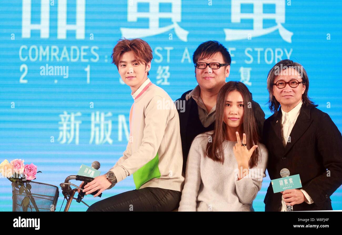 Chinese singer Lu Han, left, and Hong Kong director Peter Chan, right, pose during a press conference for music video of Lu's new song 'Comrades: Almo Stock Photo