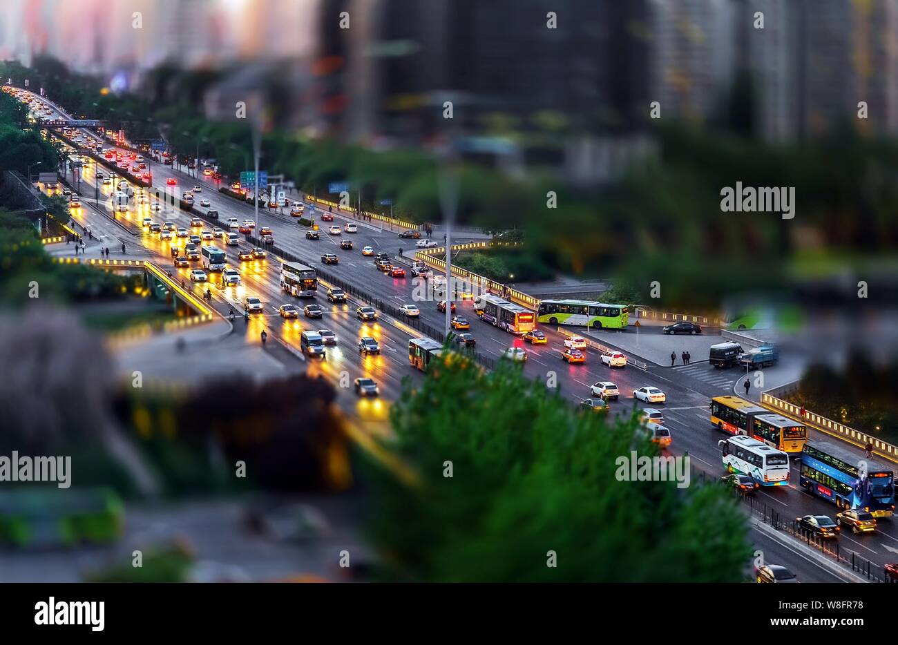 This photo taken by tilt-shift photography shows a night view of Sanyuanqiao, or Sanyuan Bridge, in Beijing, China, 25 April 2015. Stock Photo
