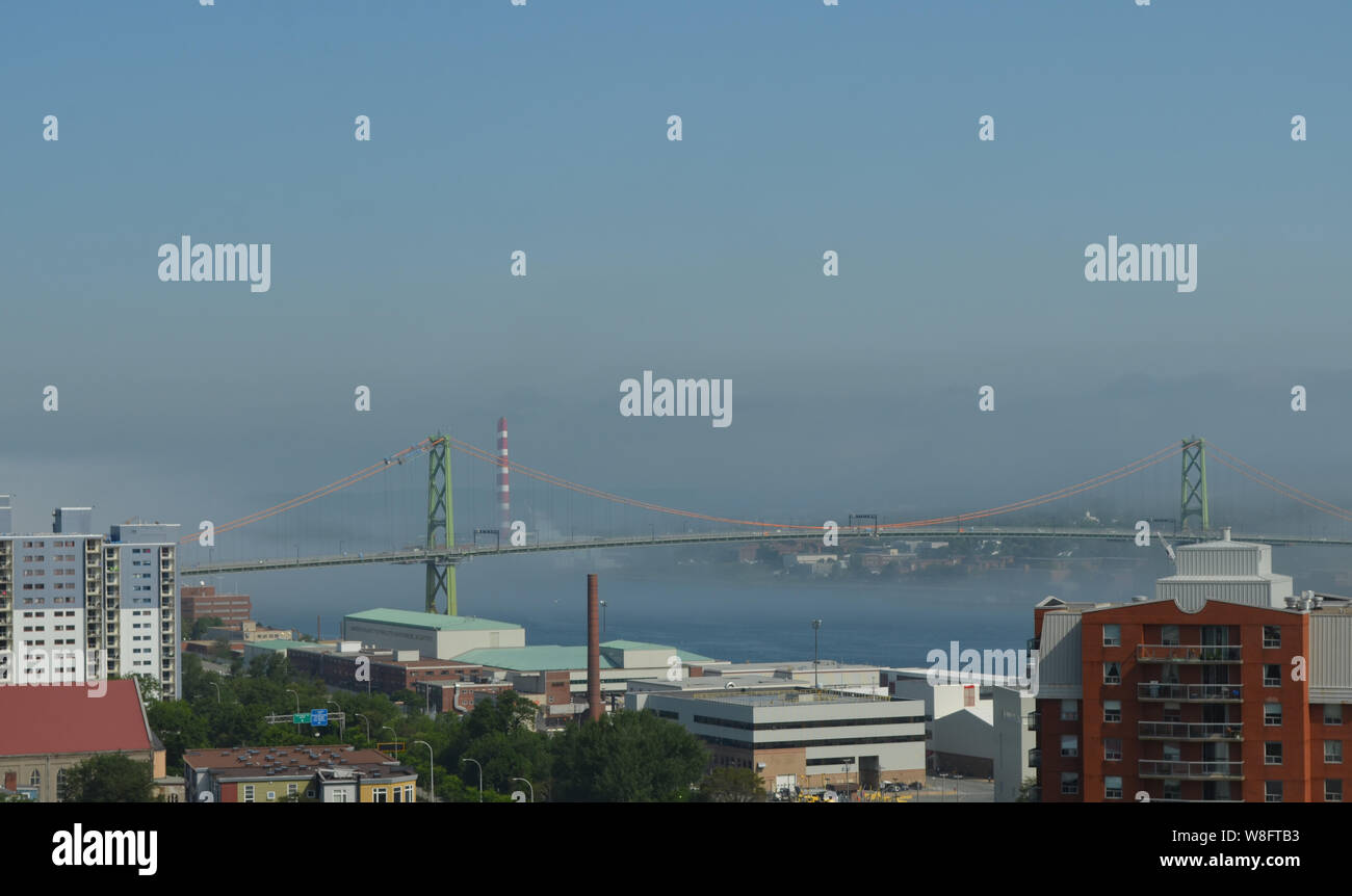 Summer in Nova Scotia: Foggy Morning Over Angus McDonald Bridge and Halifax Harbour Stock Photo