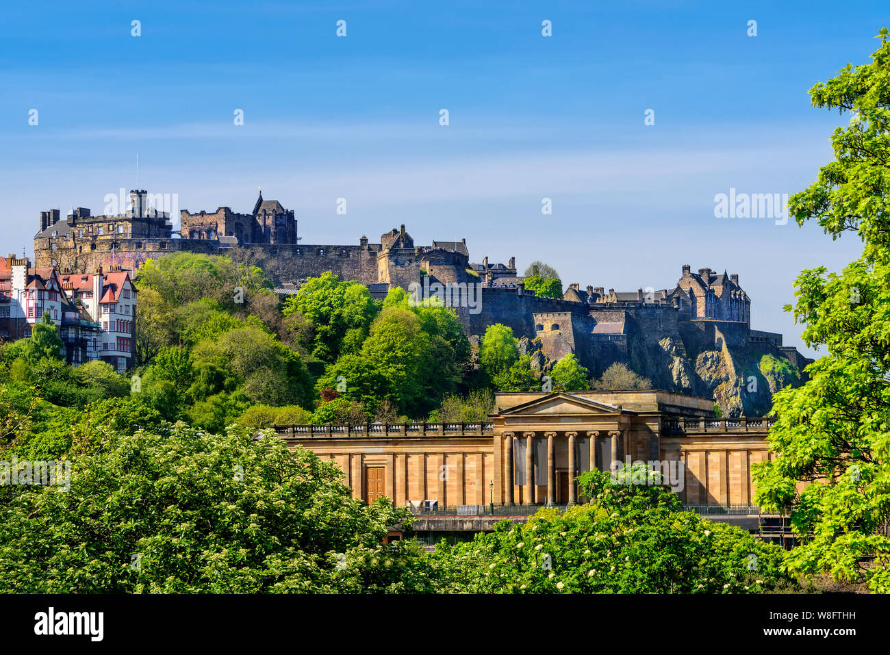 Scenic view of Edinburgh Castle, as it rests on castle rock, and the Scottish National Gallery. Stock Photo