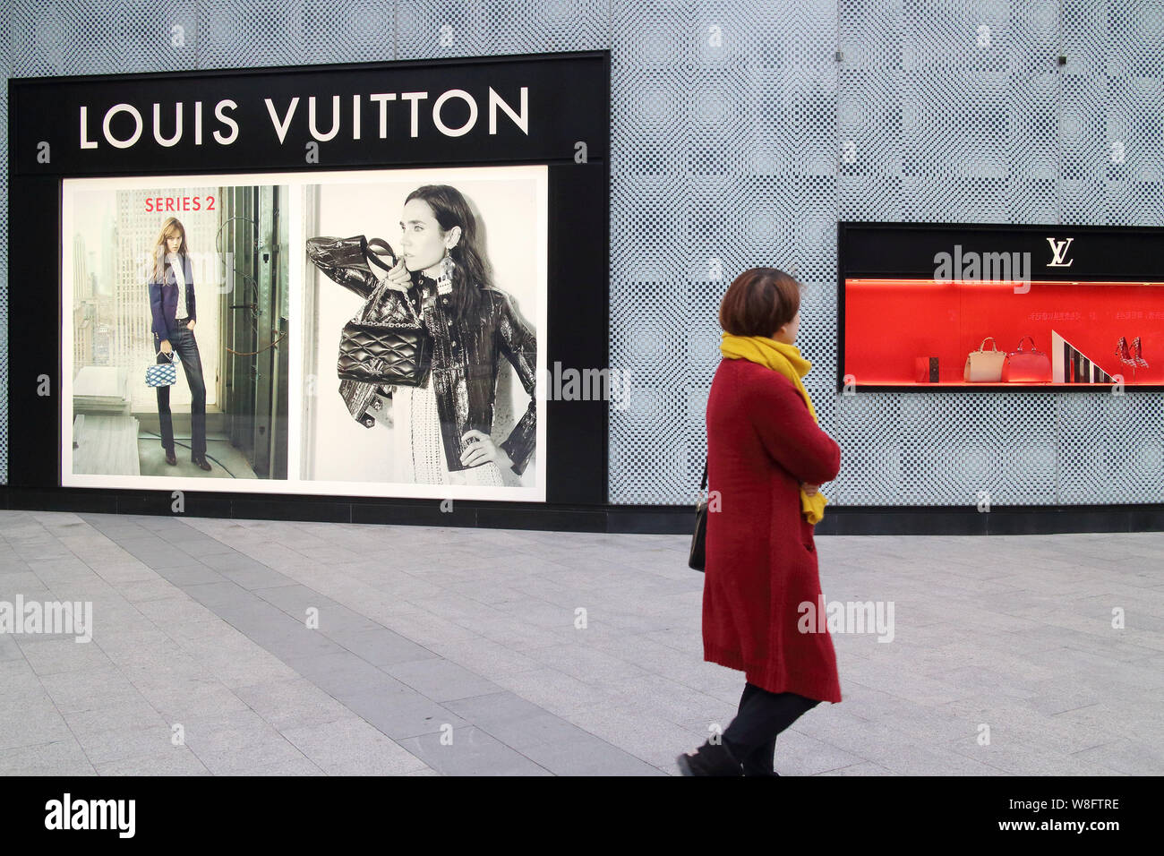 FILE--A pedestrian walks past a Louis Vuitton (LV) boutique of LVMH Moet Hennessy  Louis Vuitton SA in Fuzhou city, southeast Chinas Fujian province Stock  Photo - Alamy