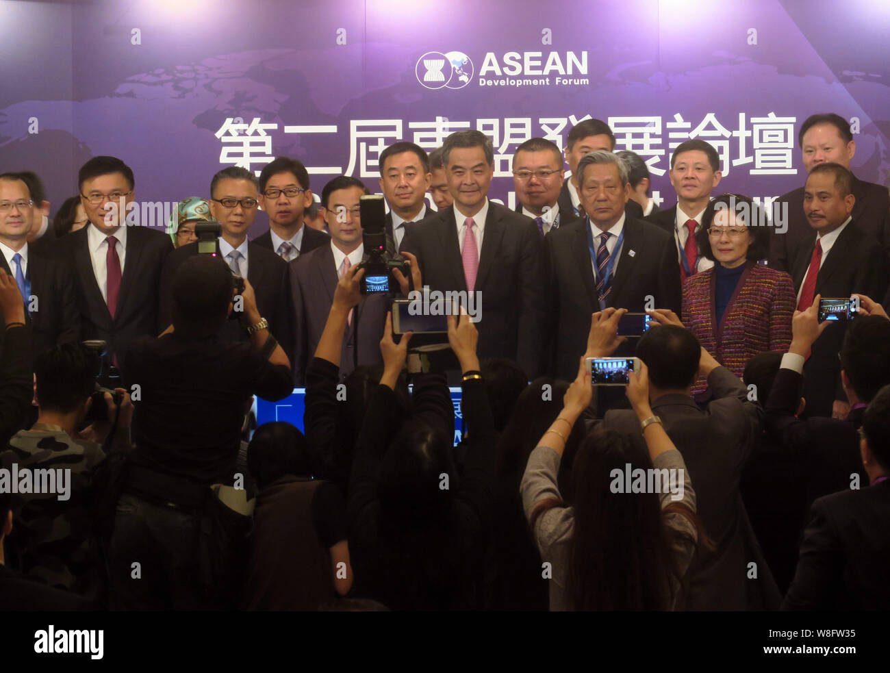 Hong Kong Chief Executive Leung Chun-ying, center, former Thai Vice Premier Phinij Jarusombat, front third right, president of Thailand-China Cultural Stock Photo