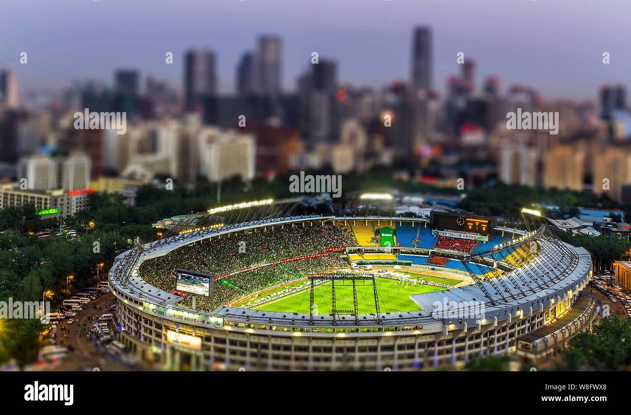 This photo taken by tilt-shift photography shows a night view of the Beijing Workers' Stadium in Beijing, China, 26 May 2015. Stock Photo