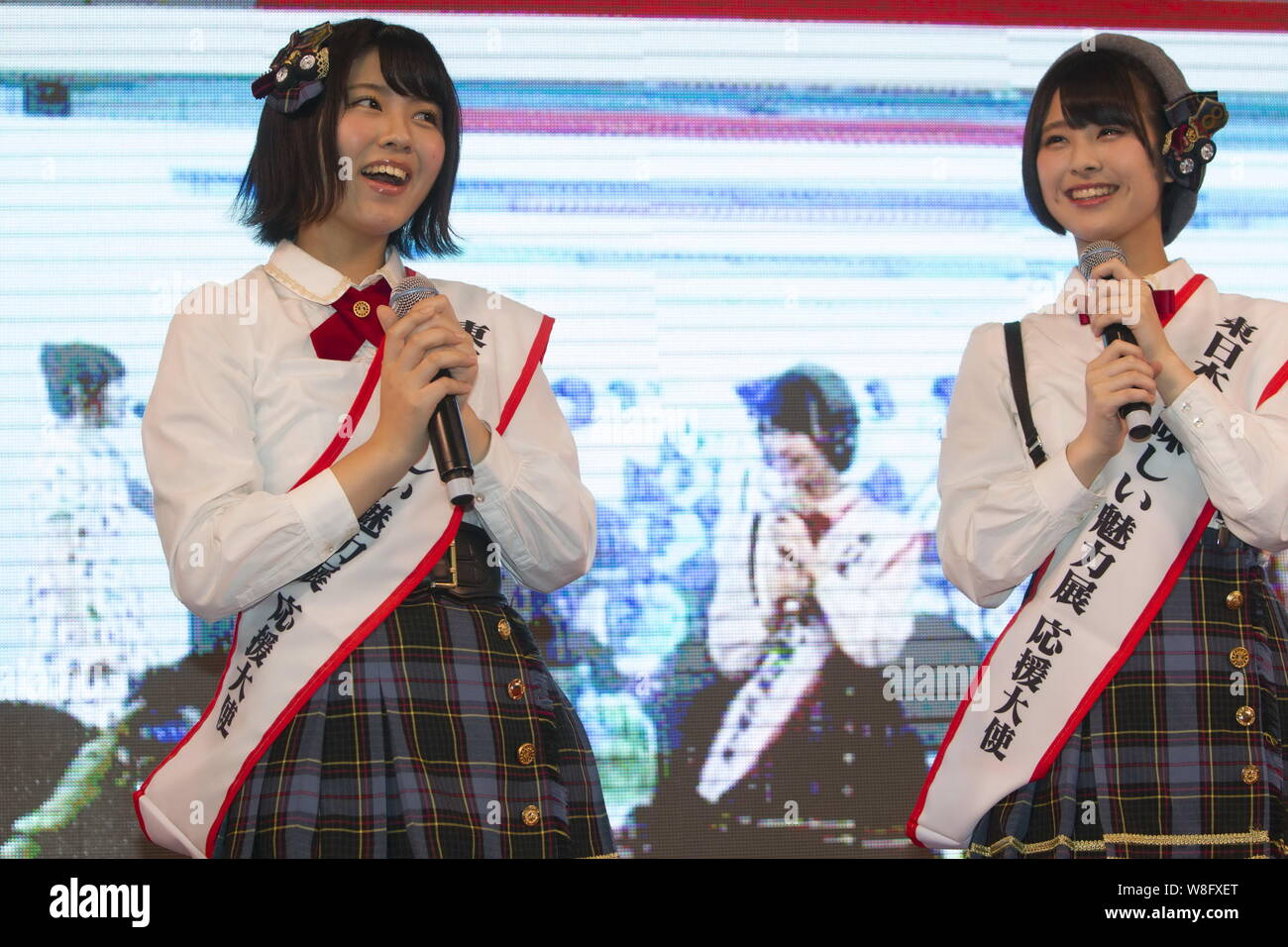 Maria Shimizu, left, and Shiori Sato of the Team 8 of Japanese idol gril group AKB48 attend a promotional event for Japanese food during the HKTDC Foo Stock Photo