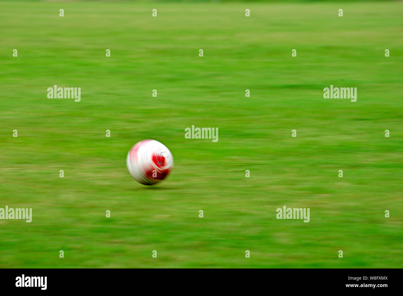 Soccer ball moving in soccer field Stock Photo Alamy