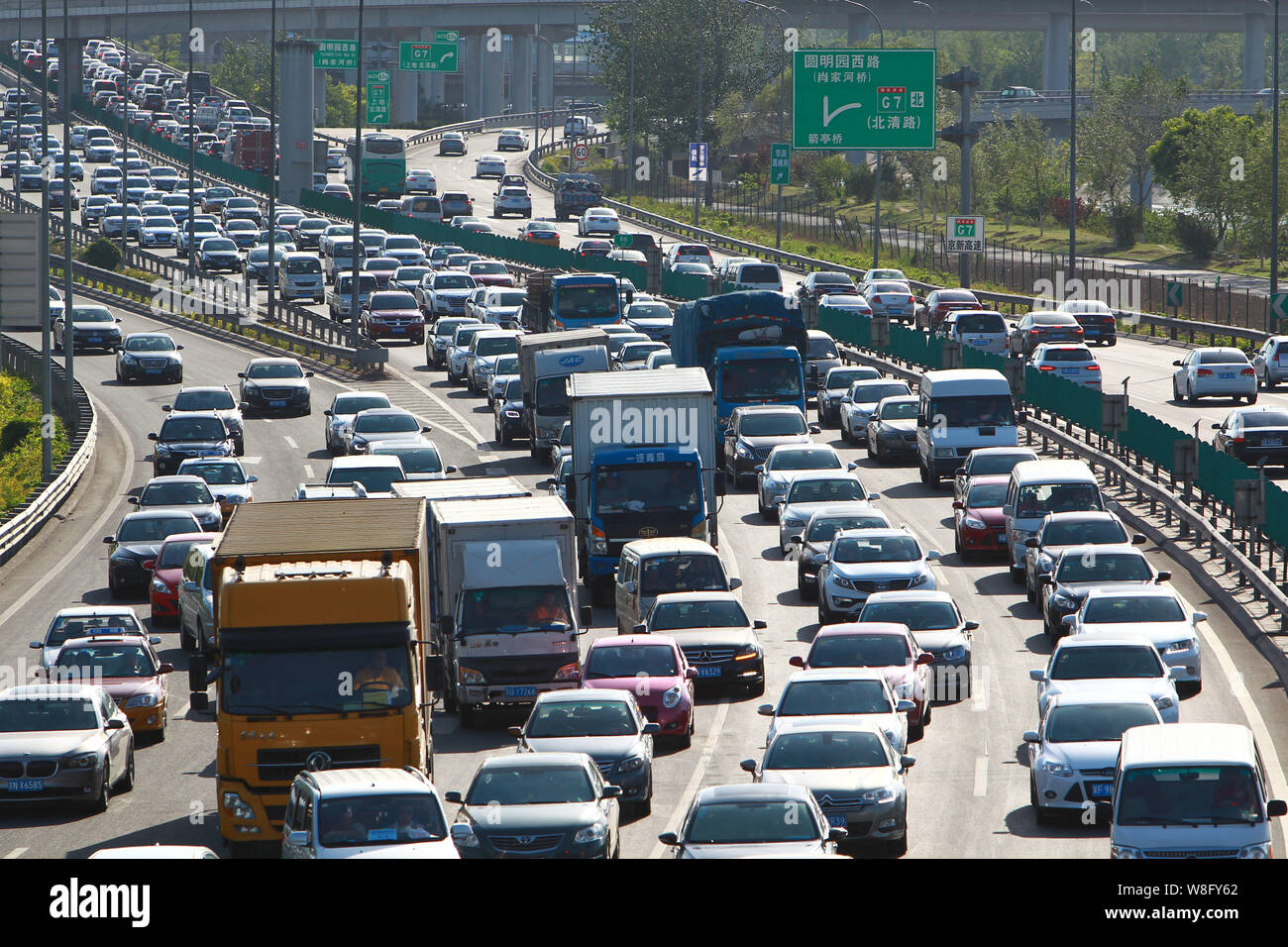 --FILE--Vehicles move slowly in a traffic jam on a road during the May Day holiday in Beijing, China, 3 May 2015.   In addition to pollution and conge Stock Photo