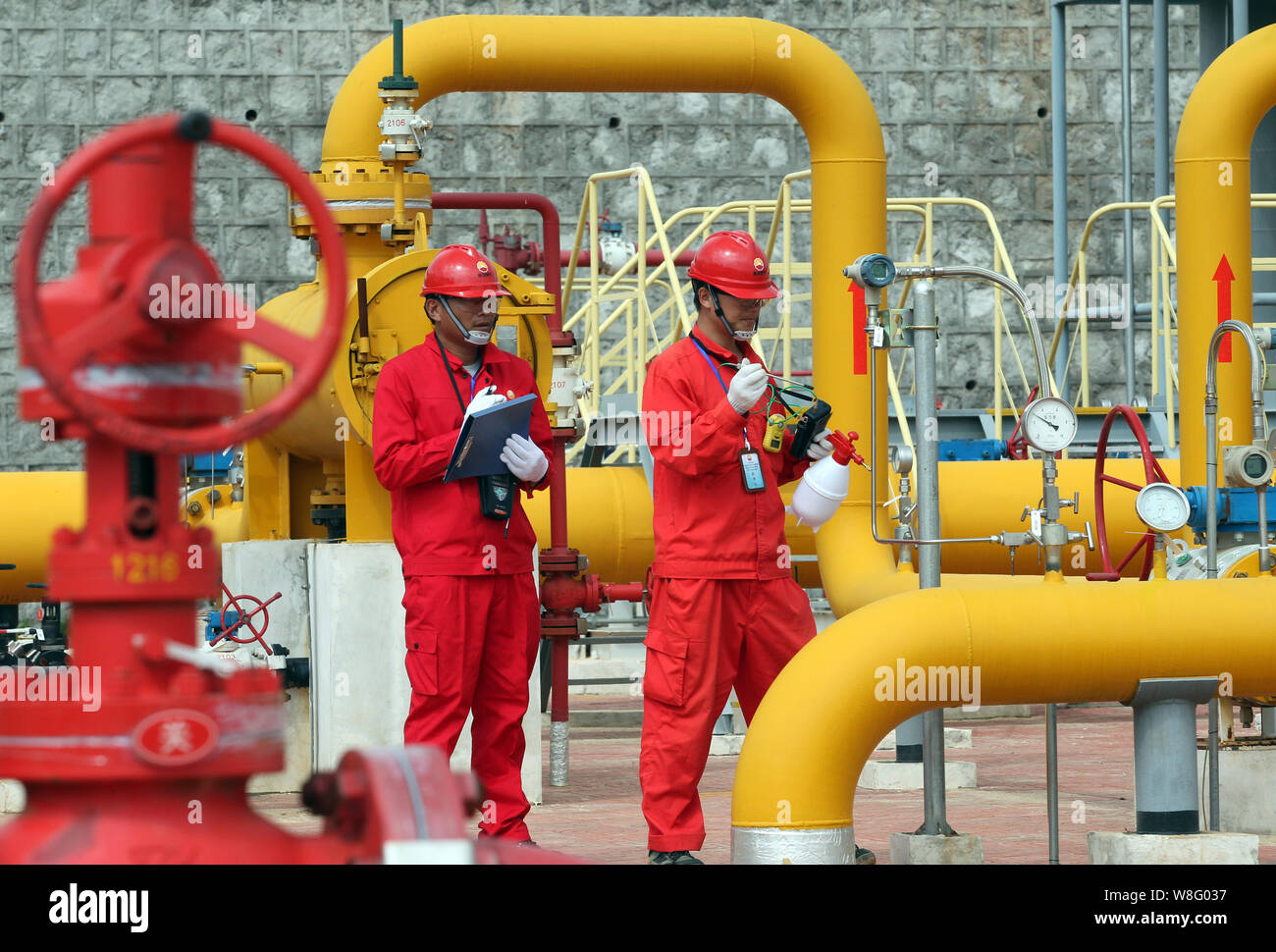 FILEChinese technicians of PetroChina Kunlun Gas Co., Ltd. check