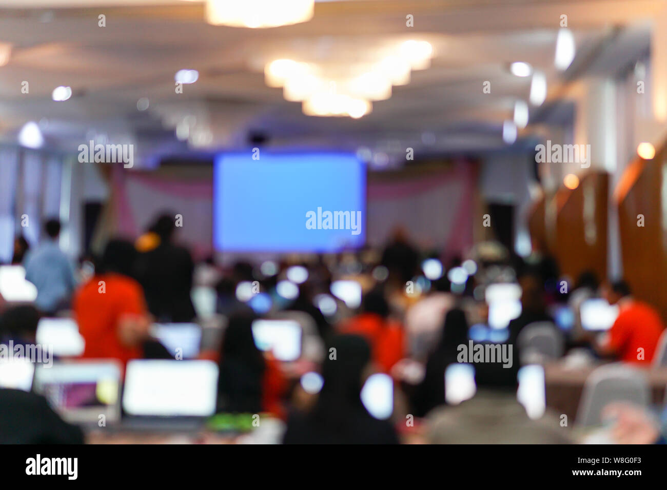 Blurry image in conference room. Abstract blurred people lecture and discussion in seminar room or conference room. Stock Photo