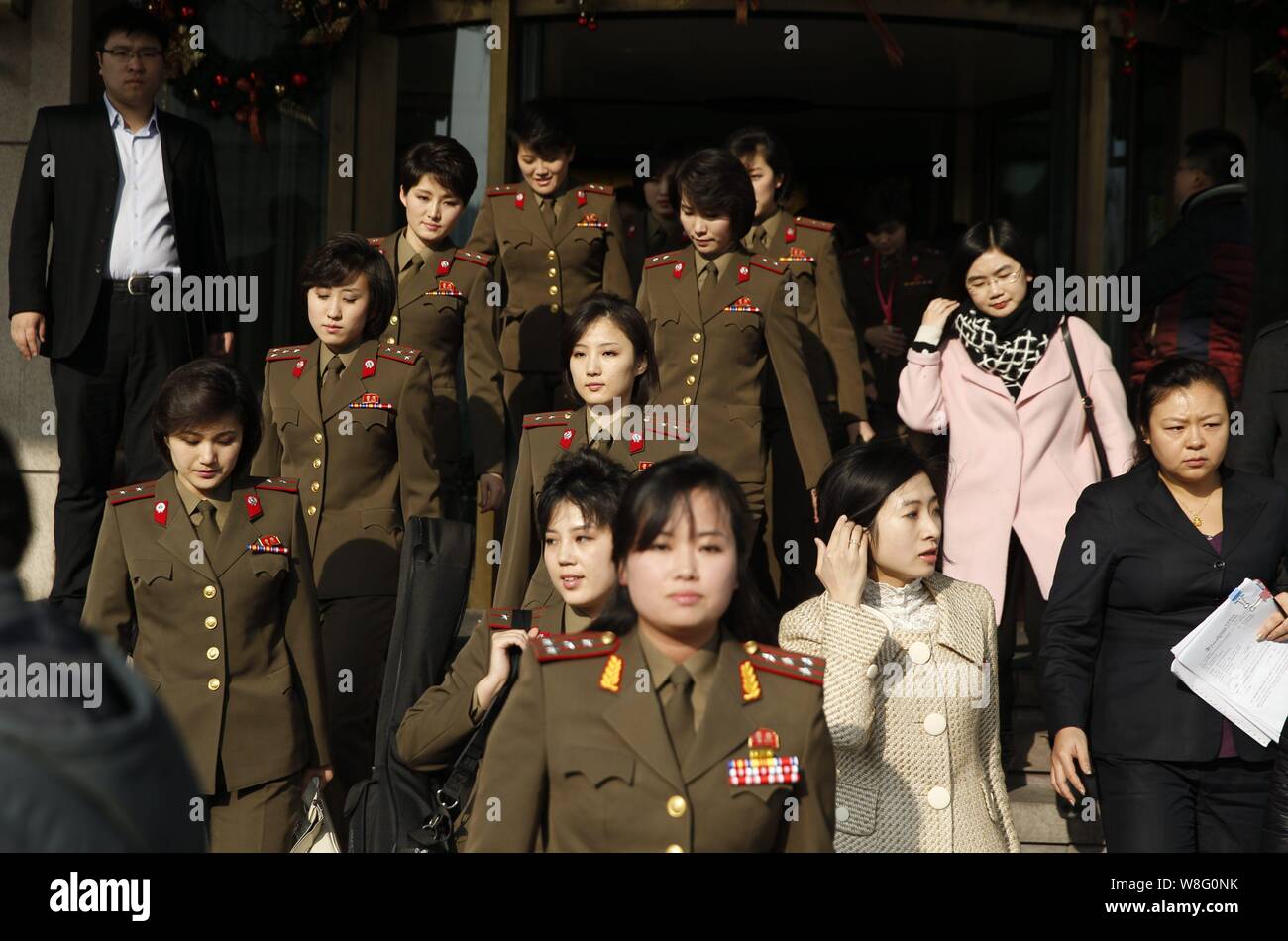 Members of North Korean pop group Moranbong Band leave a hotel for a