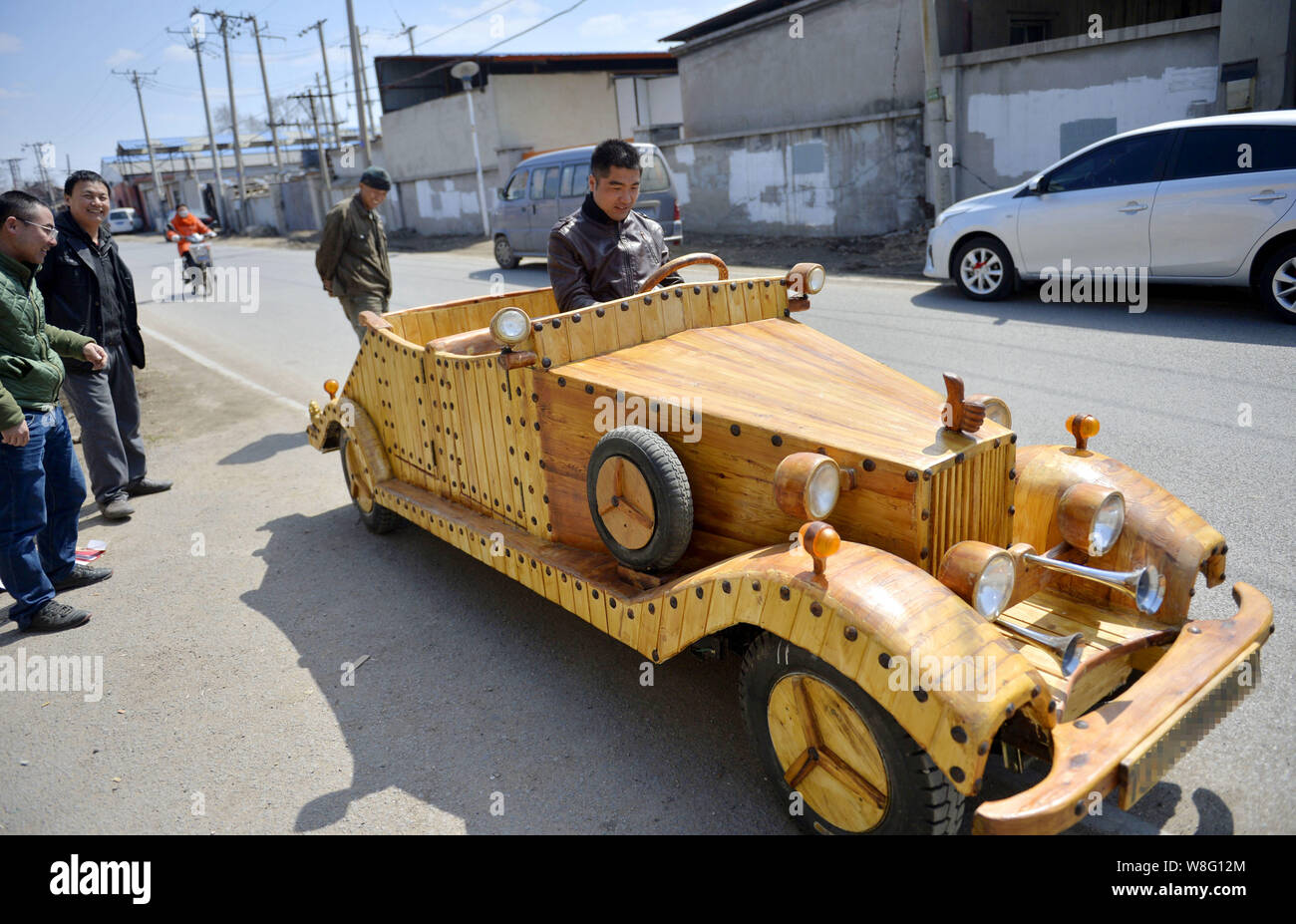 Chinese carpenter Liu Fulong testdrives his third homemade wooden