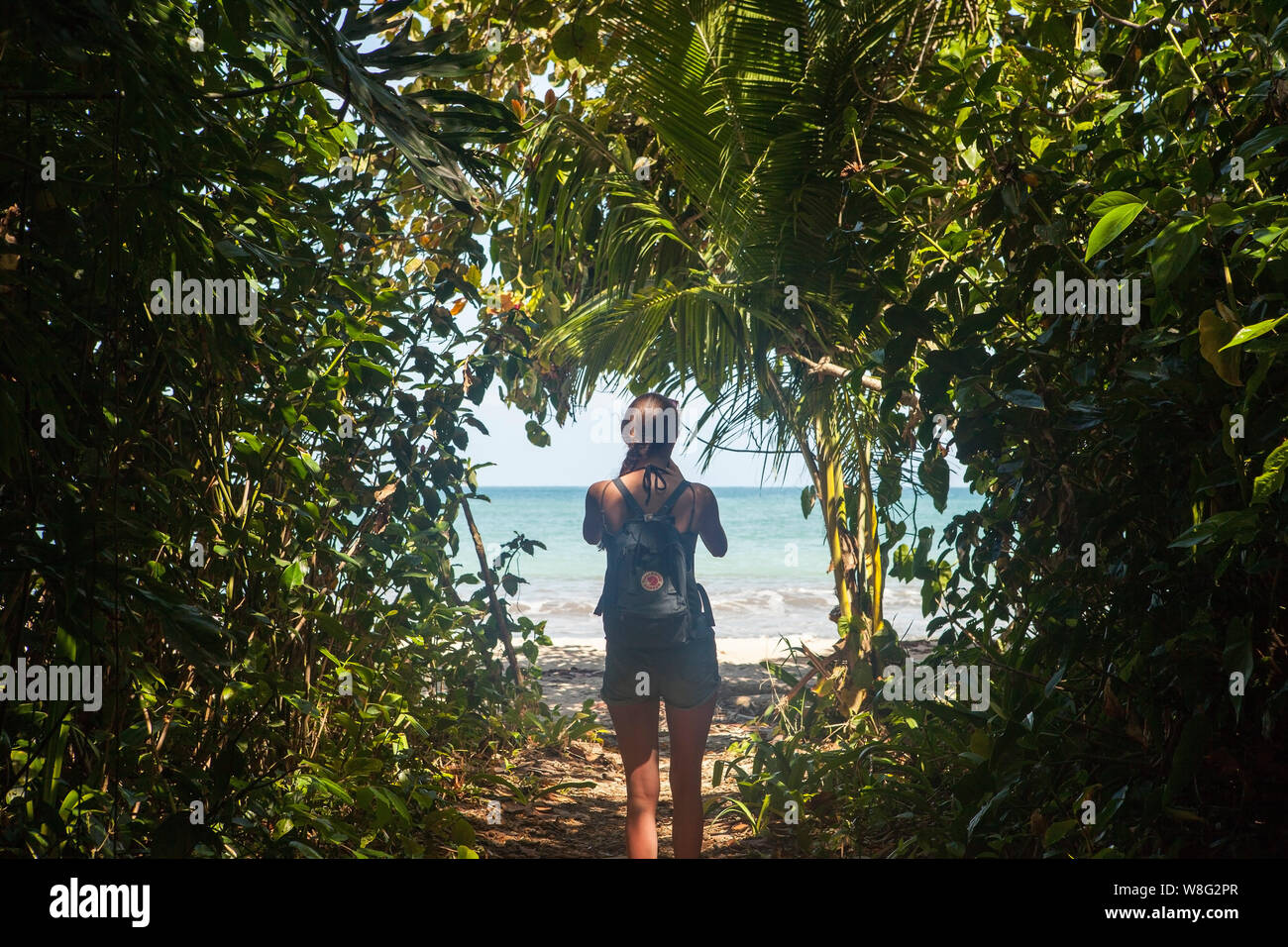 Cahuita/Costa Rica-01 February,2019:young traveler hiking in Cahuita National Park with a practical Fjallraven Kanken backpak. Swedish company special Stock Photo