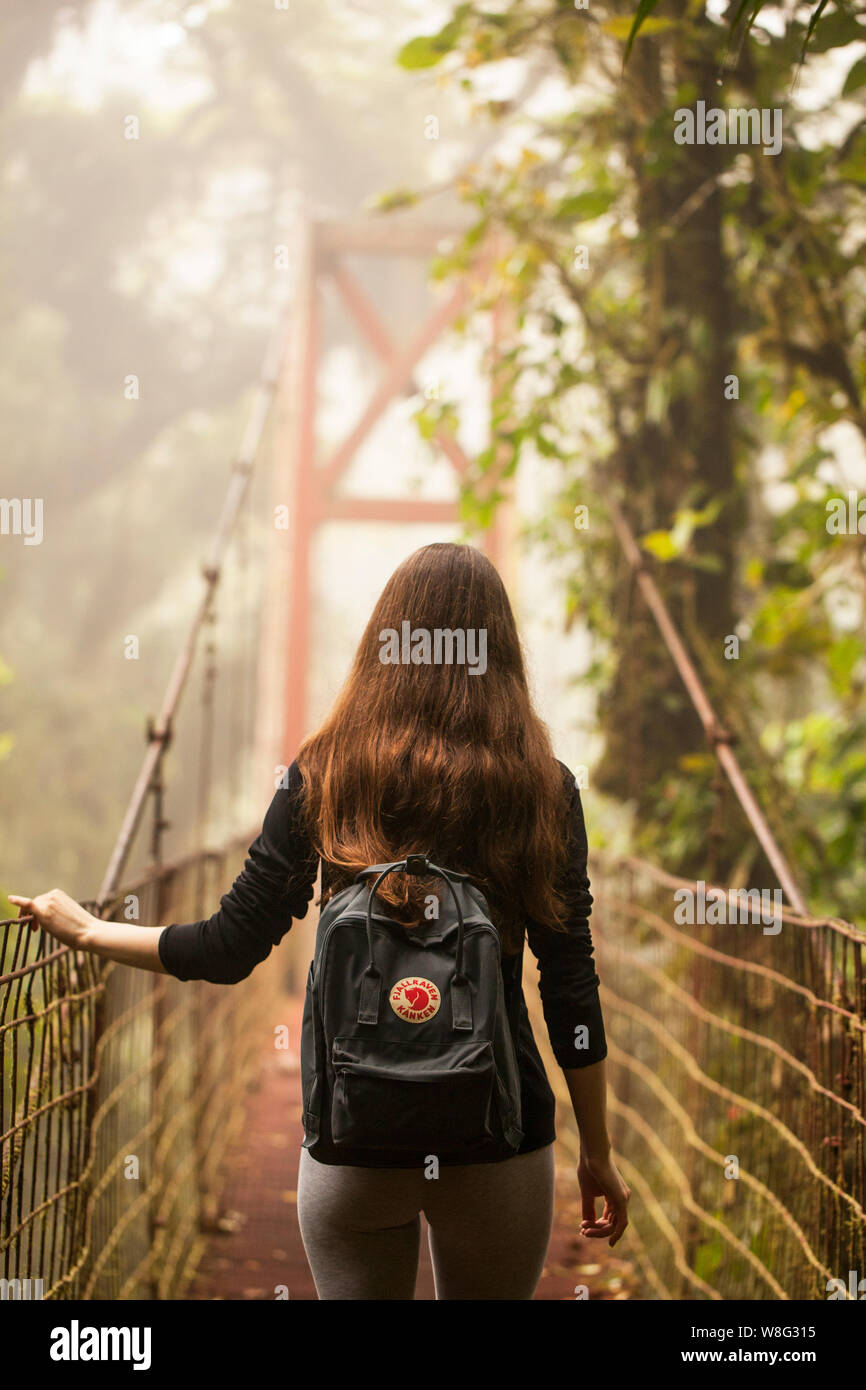 Monteverde,Puntarenas/Costa Rica-24 January,2019:young traveler hiking in Monteverde Cloud forest with a practical Fjallraven Kanken backpak. Stock Photo