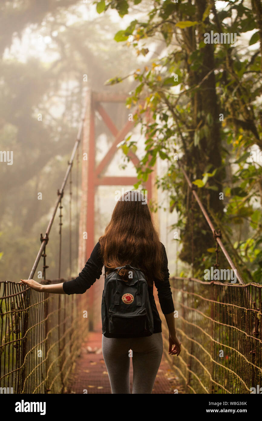 Monteverde,Puntarenas/Costa Rica-24 January,2019:young traveler hiking in Monteverde Cloud forest with a practical Fjallraven Kanken backpak. Stock Photo