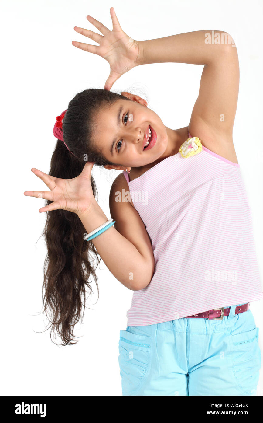Girl making a face and smiling Stock Photo