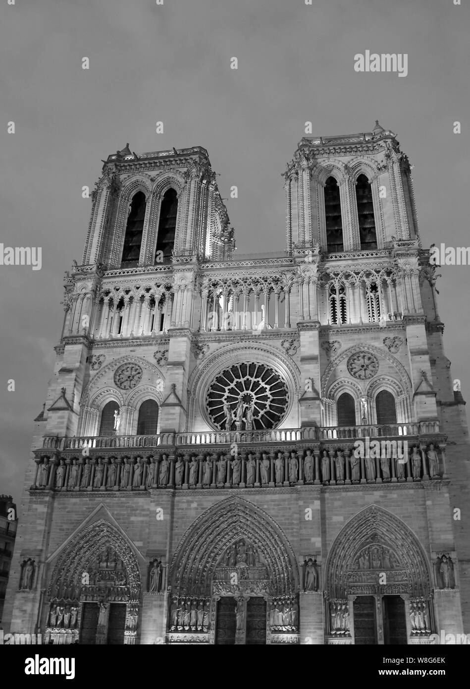 Facade of Basilica of Notre Dame de Paris in France with black and white effect Stock Photo