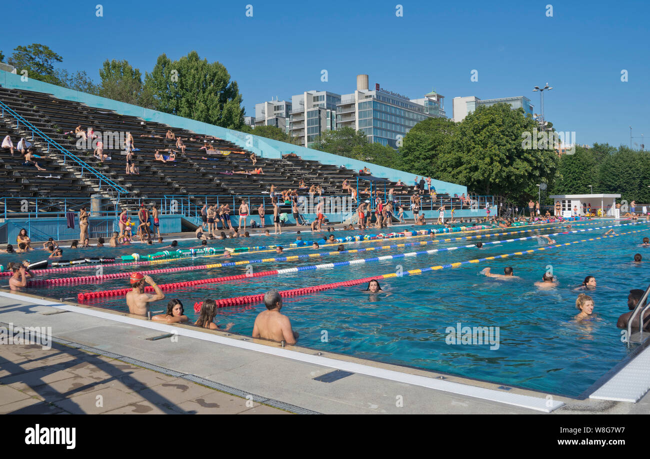 People enjoy public openair swimming pool in the summer in Stockholm