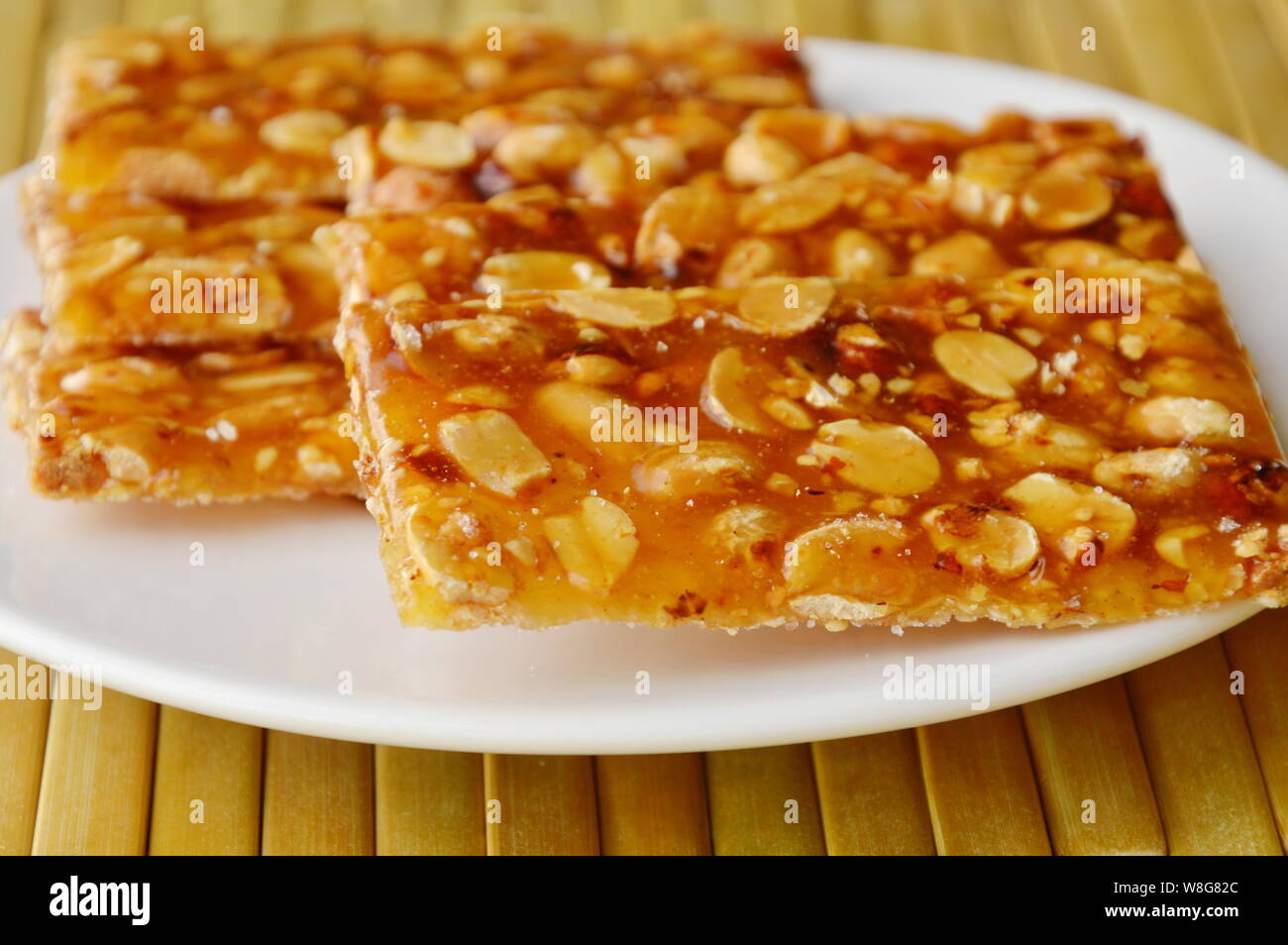 sweet peanuts bar on dish Stock Photo Alamy