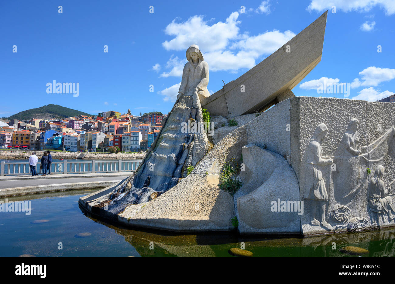 A fountain and monument to fishermen on the waterfront in the town of A Guarda in Pontevedra Province, Galicia, North West Spain. Stock Photo