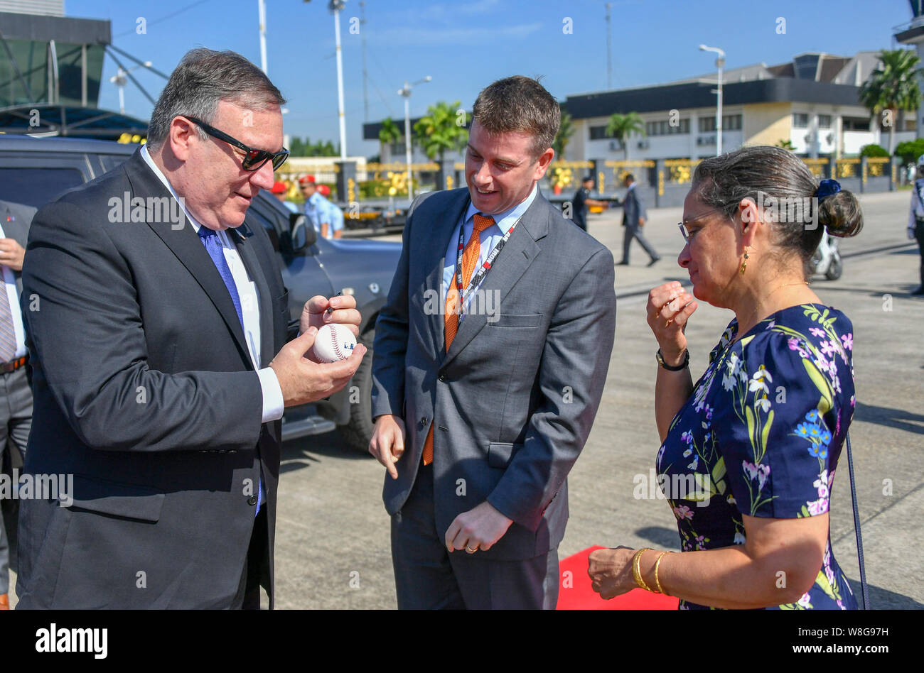 Secretary of State Michael R. Pompeo signs a baseball prior to his departure from Kuala Lumpur, Malaysia, August 3, 2018. Stock Photo