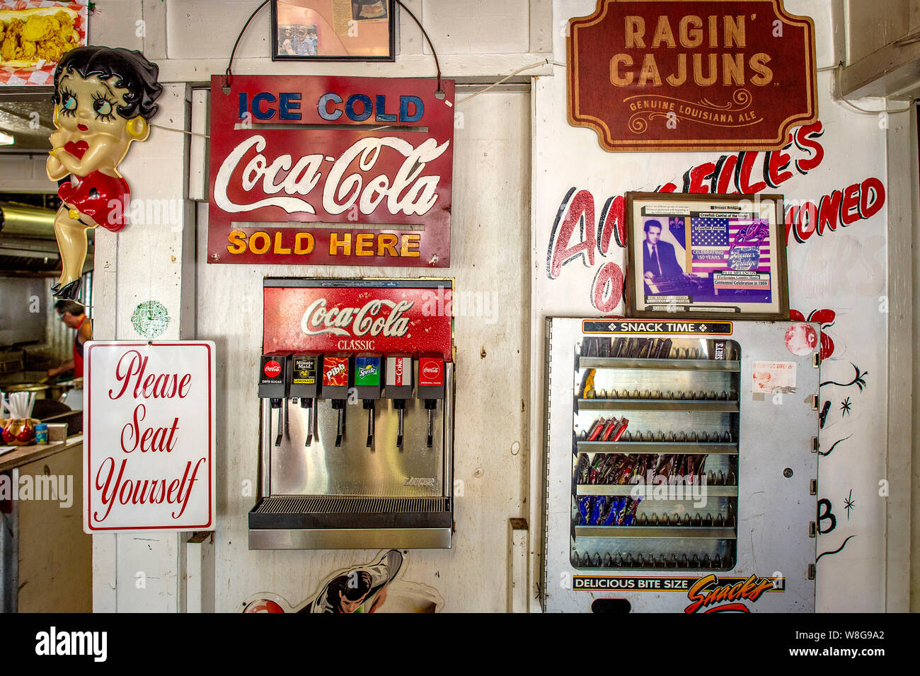 Coca-Cola sign above soda machine and candy machine at Angelle's Burgers in Breaux Bridge Louisana September 21, 2018 Stock Photo
