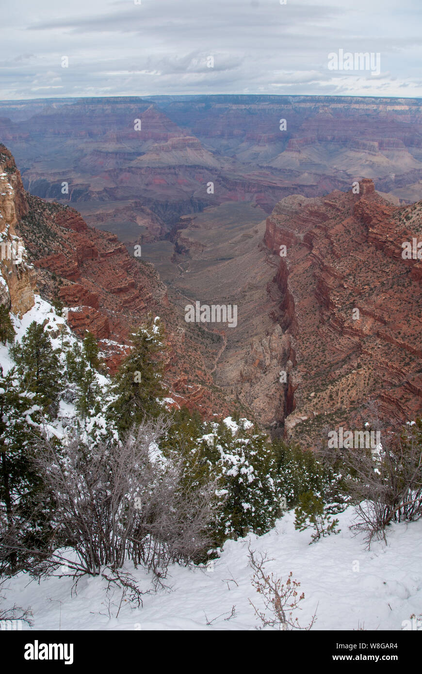 Winter time in the Grand canyon when the snow has fallen and shows the in depth beauty of one of the seven wonders of the World. Stock Photo