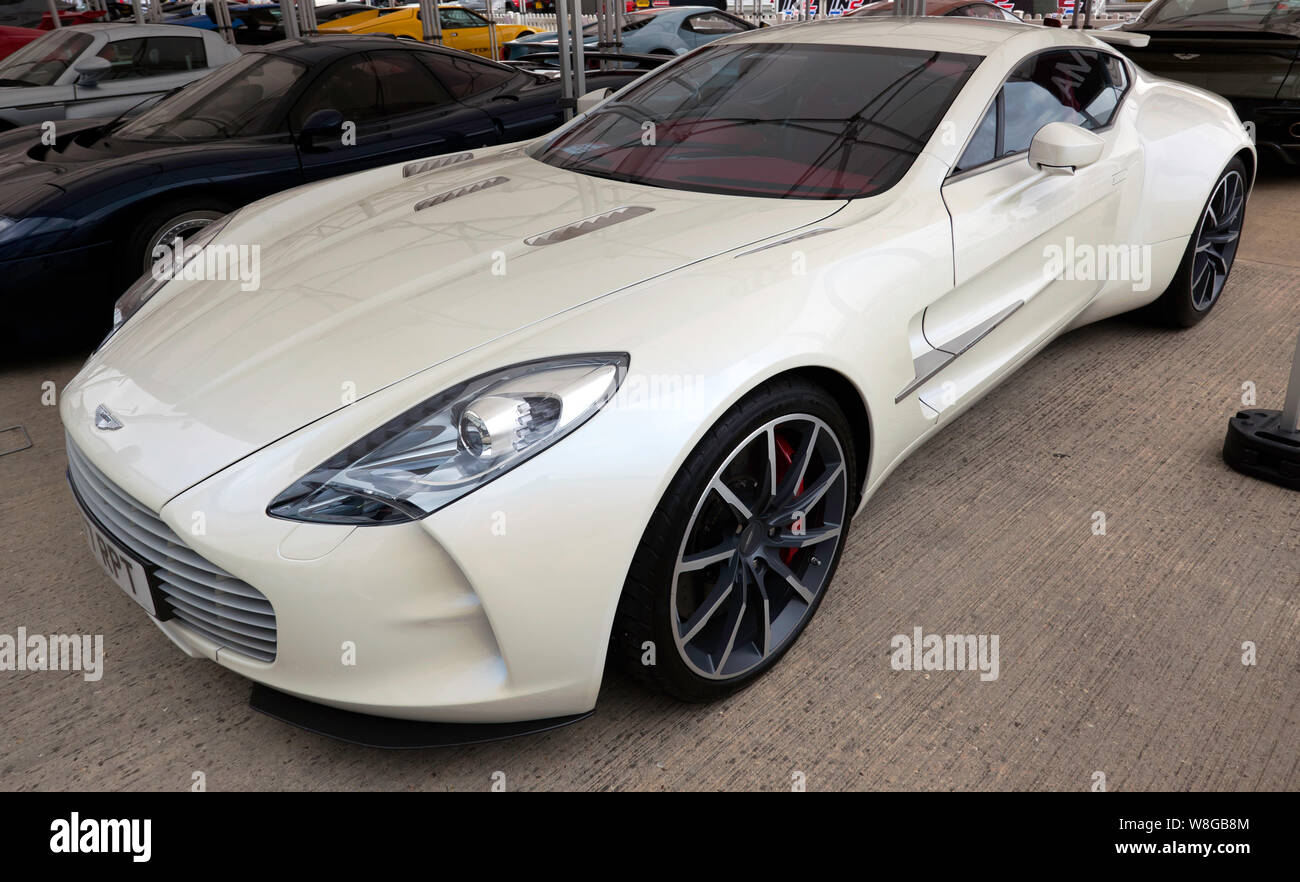 Three-quarters front view of an Aston Martin One-77, on display in the International Paddock, at the 2019 Silverstone Classic Stock Photo