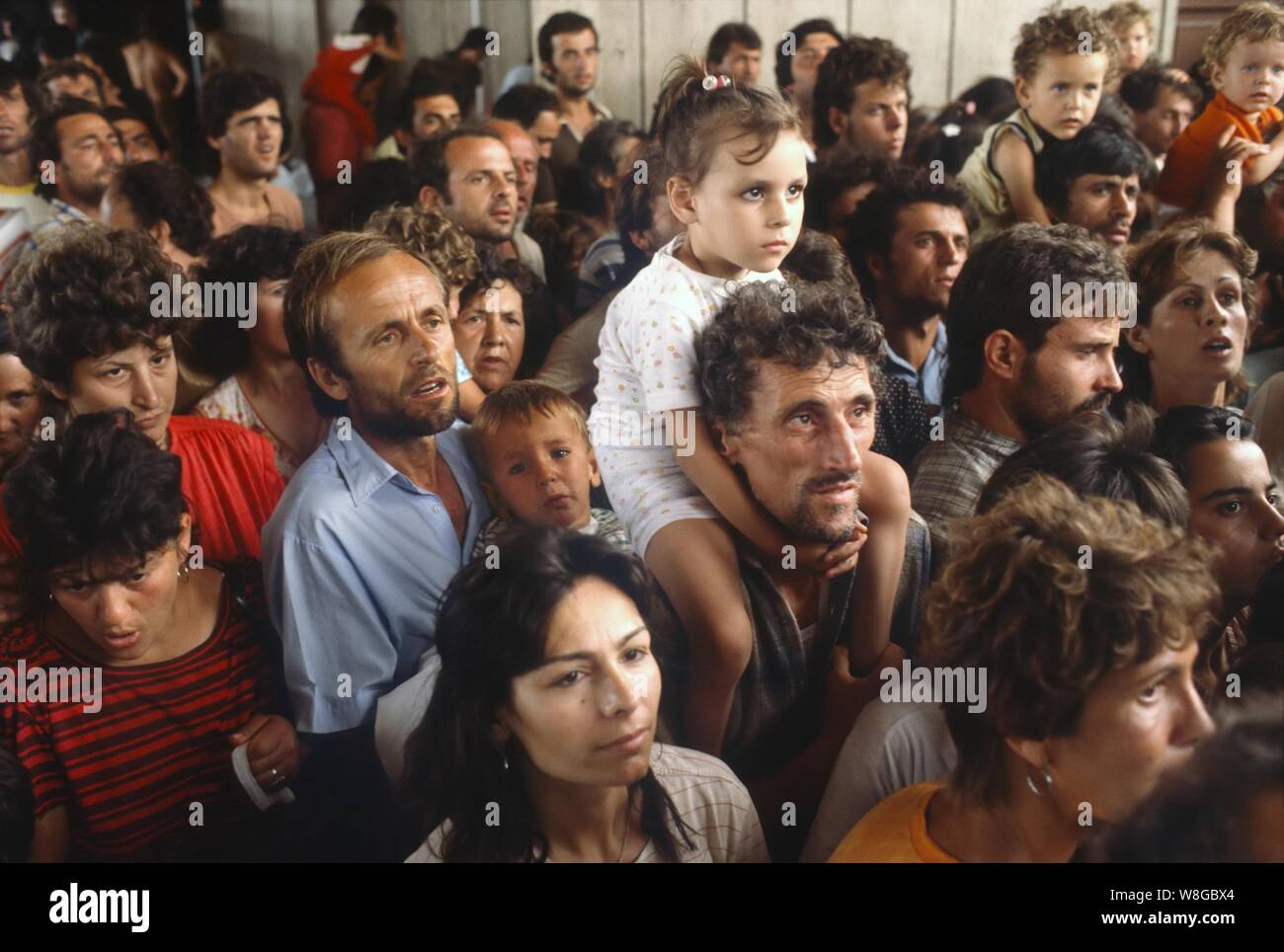 Brindisi (Italy), July 1990, Albanian refugees who had taken shelter in the embassies of Tirana to escape the totalitarian regime and absolute poverty are welcomed and sorted by special trains in different European countries. Stock Photo
