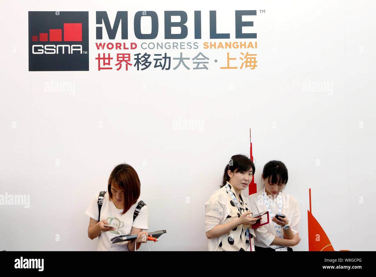Visitors rest during the GSMA Mobile World Congress 2015 in Shanghai, China, 15 July 2015. Stock Photo