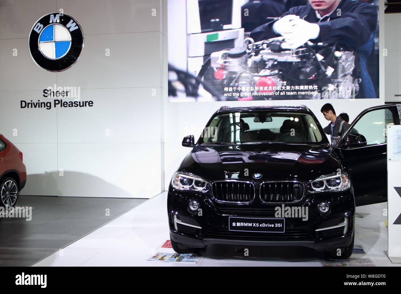 --FILE--Visitors look at a BMW X5 xDrive 35i during an automobile exhibition in Fuzhou city, southeast China's Fujian province, 30 September 2015.   B Stock Photo