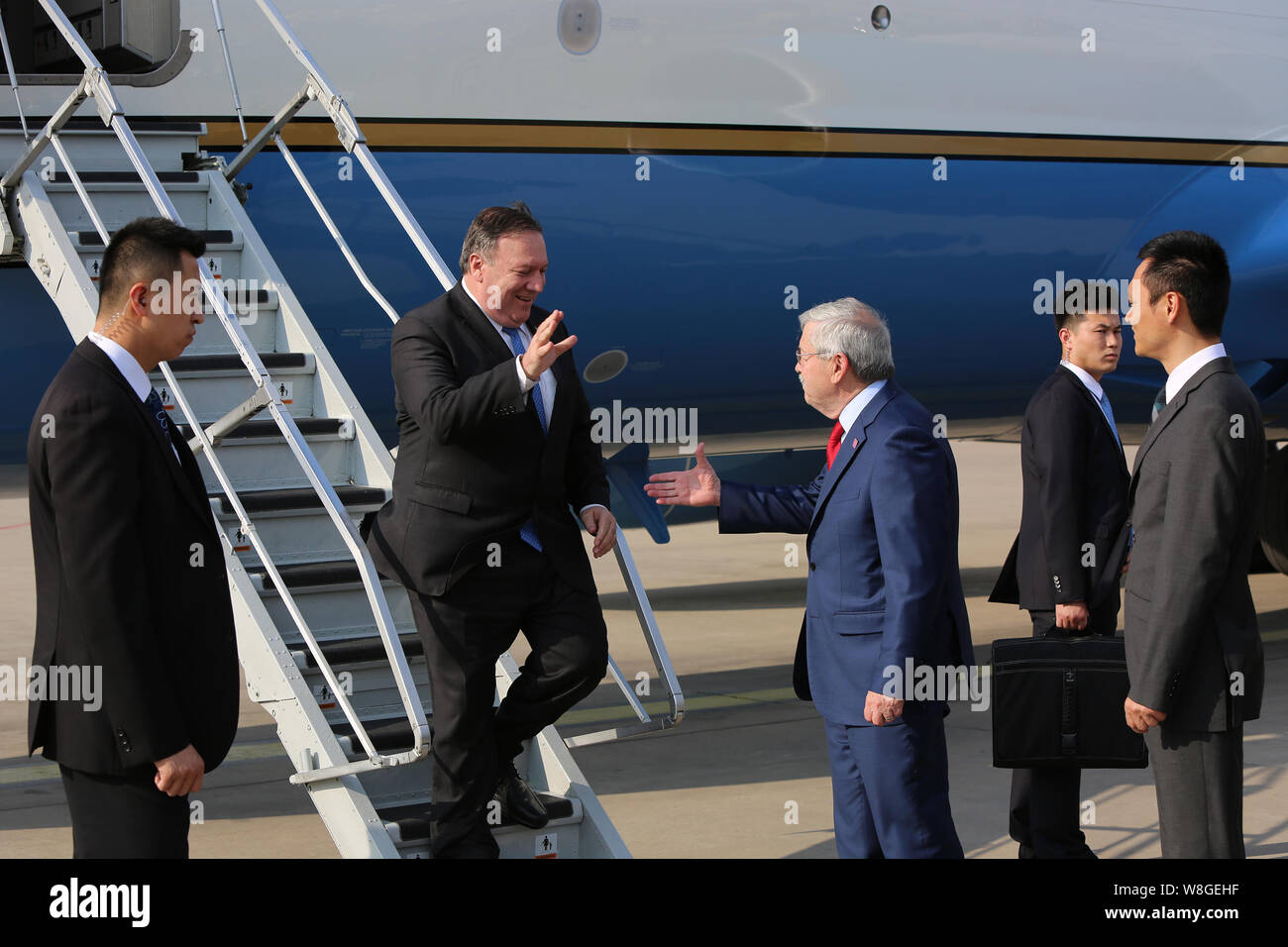 U.S. Secretary of State Mike Pompeo is greeted by U.S. Ambassador to China Terry Branstad upon arrival to Beijing, China on June 14, 2018. Stock Photo