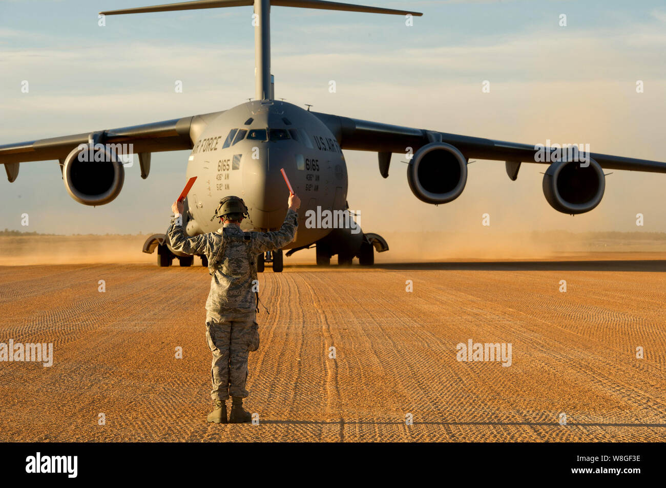 Joint Readiness Training Center - man taxiing in a large military cargo plane Stock Photo